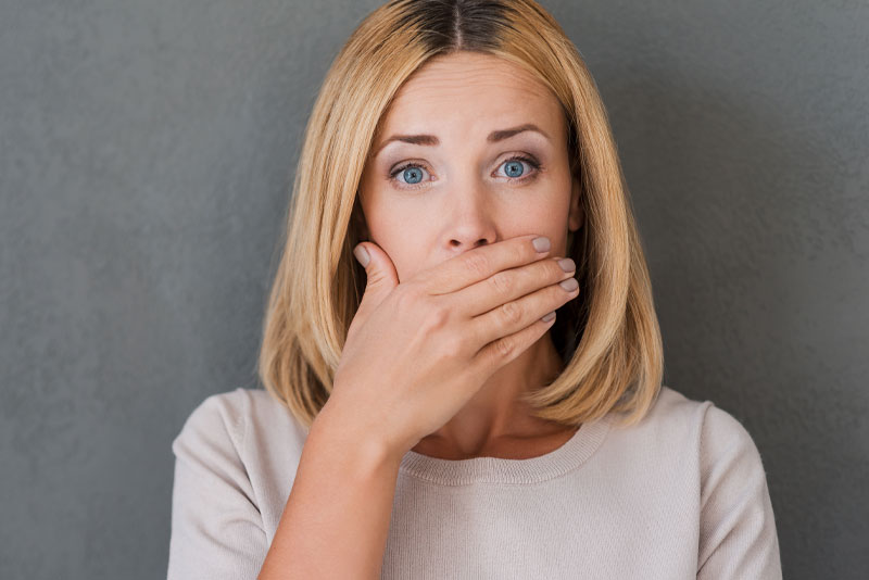 dental patient covering mouth